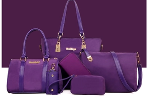 Six-piece purple nylon bag set with tote, boston bag, and crossbody handbags with gold hardware