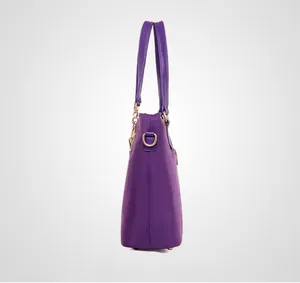 Side view of large purple nylon tote bag featuring golden D-ring and leather handles
