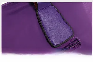 Macro shot of purple nylon fabric texture and precise stitching on the luxury handbag