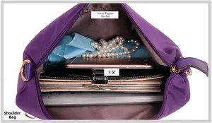 Detail view of the nylon bag interior showing main compartment and zippered wall pocket