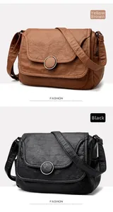 Detail view of vintage soft leather crossbody bags with large round buckle decorations