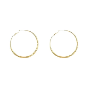 Fashionable large golden twisted hoop earrings for women with a minimalist metallic design