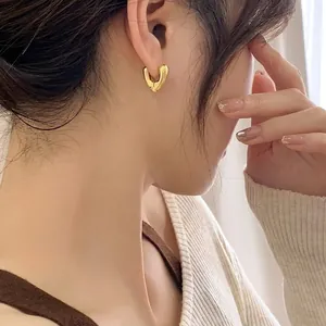 18K gold plated heart earrings featuring a 3D V-shape minimalist polished mirror design