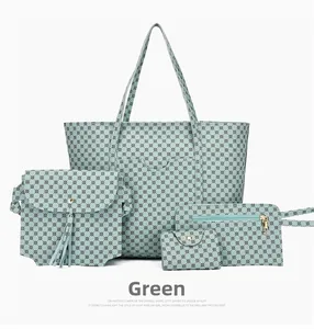 Dettaglio set di 4 borse verde menta con stampe geometriche e finiture metalliche oro