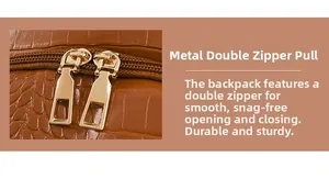 Close-up of golden dual metal zippers on brown crocodile texture leather backpack