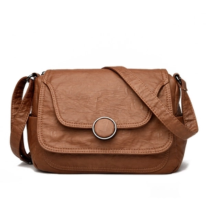 Classic brown retro leather shoulder bag with circular metal buckle and soft texture