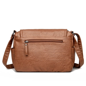 Classic brown pebble leather shoulder bag with back zipper pocket and adjustable strap