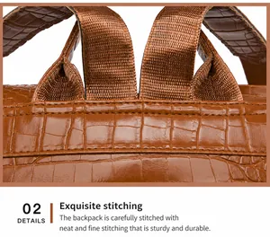 Close-up of brown PU leather backpack with crocodile texture and reinforced stitching