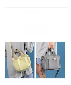 Detail view of the thick canvas texture and symmetrical front pockets on small tote bags
