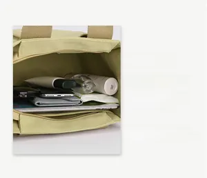 Detailed view of the large capacity canvas tote bag interior with storage compartments