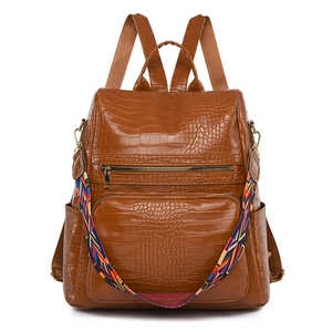 Brown crocodile texture anti-theft backpack with stylish colorful woven shoulder strap