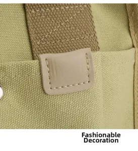 Detailed close-up of premium canvas stitching and brown leather accent on green handbag