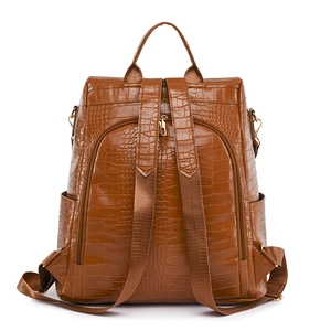 Brown crocodile-textured anti-theft backpack with rear zipper pocket and soft PU leather