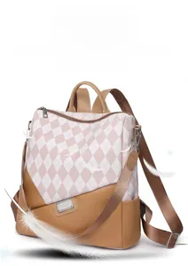 Detail of a lightweight color-block backpack showing the faux leather and quilted texture