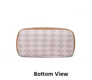 Detailed bottom view of the contrast color backpack showing stitching and leather piping