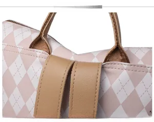 Detail view of the contrast color backpack showing precise stitching and leather handles