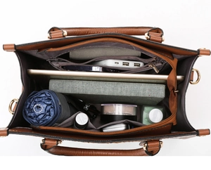 Detailed interior of brown leather tote showing spacious capacity and inner pockets