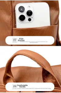 Detail of reinforced handle and side pocket on brown vintage textured faux leather backpack