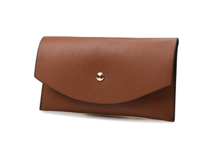 Close-up of brown litchi pattern envelope clutch bag with golden round metal buckle