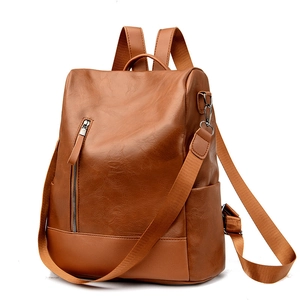 Brown faux leather backpack with adjustable straps and metal zipper detail