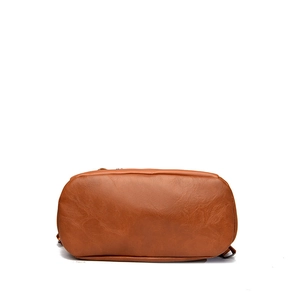 Bottom view of brown contrast leather backpack showing fine texture and smooth corners