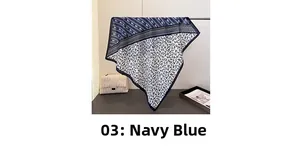 Detail of navy blue floral scarf showing draped lightweight fabric and elegant patterns