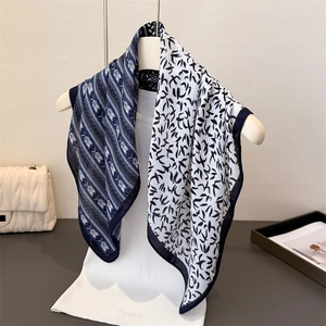 Elegant navy and white silk scarf with swallow pattern and geometric herringbone print