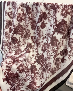 Detailed macro view of retro floral cotton-linen scarf with elegant burgundy printing
