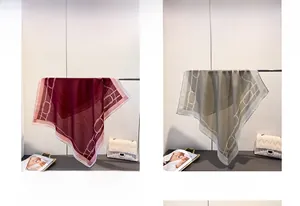 Detail showing herringbone patterns and chain motifs on square scarves in red and grey colors