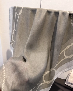 Close-up of herringbone weave fabric and nautical rope print on a taupe scarf scarf
