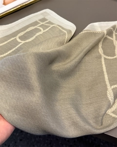 Close-up of herringbone weave cotton linen scarf with nautical rope and knot print detail