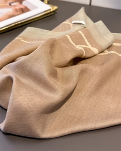 Close-up of herringbone weave cotton scarf with elegant rope pattern and contrast border