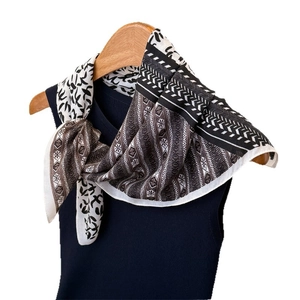Three-color geometric scarf with swallow print on a knit vest and white background