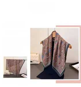 Detail of vintage silk scarf with horse equestrian print and houndstooth texture