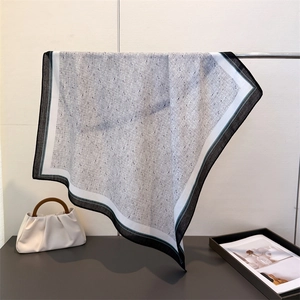 Detail of lightweight cotton-linen square scarf with dotted print and striped borders