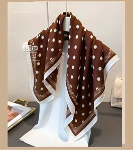 Detail of vintage brown polka dot scarf draped on a mannequin for elegant styling