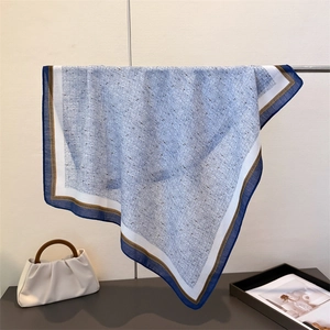 Blue herringbone cotton-linen square scarf with dark borders and fine texture display