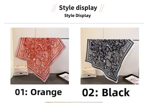 Detailansicht der Paisley-Muster-Schals in Orange und Schwarz mit feiner Saumkante