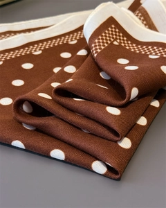 Macro detail of twill weave texture on caramel polka dot cotton linen square scarf