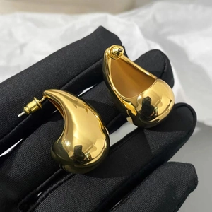 Polished 18K gold plated teardrop open earrings with a smooth minimalist metallic finish