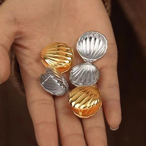 18K gold plated shell earrings set showing openable hinge structure and metallic texture
