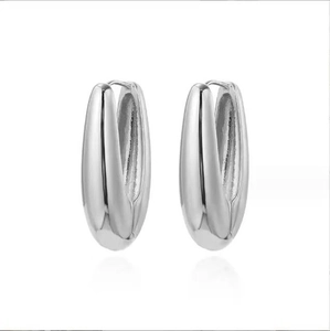 Polished silver teardrop dangle earrings with a minimalist sleek mirror finish
