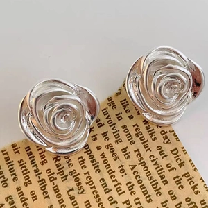 Elegant 18K gold plated silver camellia flower stud earrings with layered metallic petals