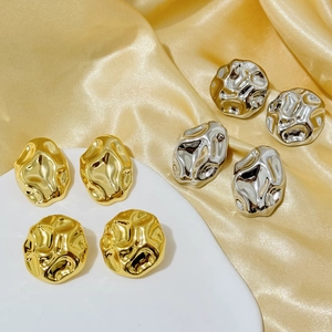 Fashionable textured metal earrings set with irregular molten gold and silver finish