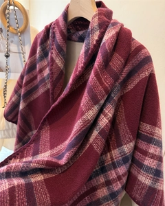 Detailed close-up of premium plaid cashmere-feel triangle shawl scarf in deep wine red