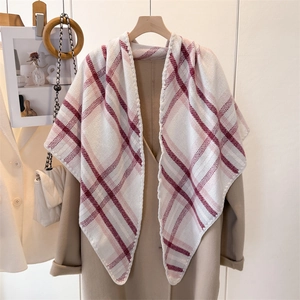 Classic ivory plaid scarf shawl with deep red accents over a stylish camel coat