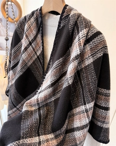Detail of classic thick check pattern on warm shawl with high-quality stitching texture