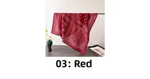 Detail of red paisley silk scarf showing soft drape and lightweight translucent fabric