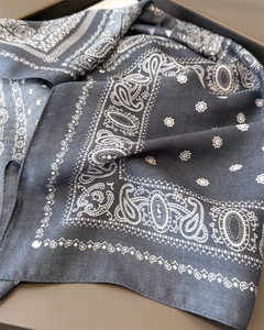 Close-up of deep blue paisley cotton-linen scarf showing detailed twill weave texture