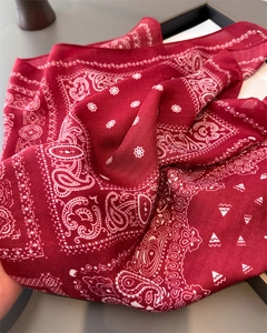 Detailed view of dark red paisley cotton square scarf with soft texture and vintage pattern